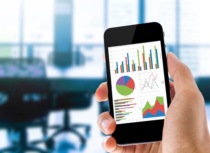 hand holding mobile phone with analyzing graph